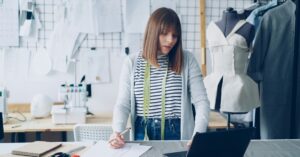 A fashion designer at work using her laptop