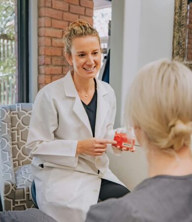 A doctor talking to a patient in a waiting room