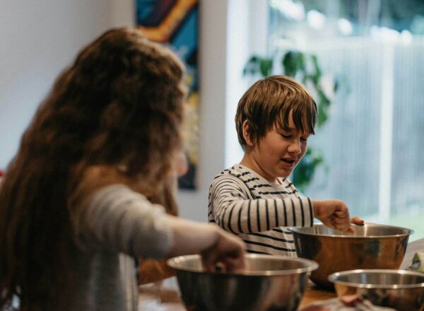 Two children cooking the kitchen