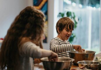 Two children cooking the kitchen