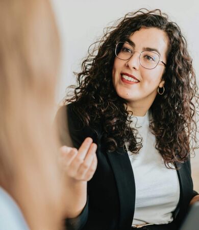 A specialist mortgage broker for doctors talking to one of her clients