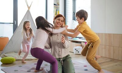 A mum playing with her three kids